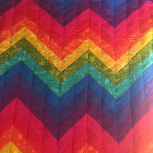 Front side of child&#039;s rainbow quilt - Jill Holden